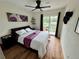 Inviting bedroom featuring stylish decor, shelving, and a sliding glass door for ample light and access at 10785 W 63Rd Pl # 108, Arvada, CO 80004
