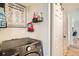 Functional laundry area with a modern washer and dryer, plus storage solutions for laundry supplies at 10785 W 63Rd Pl # 108, Arvada, CO 80004