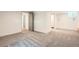 Spacious basement featuring neutral carpet, doors to other rooms and a storage closet at 814 S High St, Denver, CO 80209
