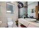 Modern bathroom featuring a vessel sink, designer lighting, and custom tile work at 814 S High St, Denver, CO 80209