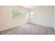 Bright bedroom featuring plush carpeting, multiple windows, and ample natural light at 814 S High St, Denver, CO 80209