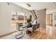 Contemporary dining room featuring a glass-top table, modern lighting, and hardwood floors at 814 S High St, Denver, CO 80209