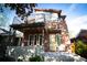 Modern two-story home boasts a brick facade and spacious balcony for outdoor enjoyment at 814 S High St, Denver, CO 80209