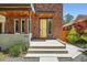 Inviting front exterior of the house featuring a modern door and landscaped surroundings at 814 S High St, Denver, CO 80209