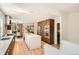 Bright and open kitchen featuring a large island, stainless appliances, and wooden cabinetry at 814 S High St, Denver, CO 80209