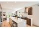 Open kitchen featuring a center island, stainless steel appliances, and modern cabinetry at 814 S High St, Denver, CO 80209