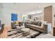 Bright living room featuring modern furnishings, stylish decor, and hardwood floors at 814 S High St, Denver, CO 80209