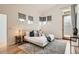 Bright main bedroom featuring hardwood floors, modern decor, and a serene atmosphere at 814 S High St, Denver, CO 80209