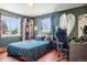 Cozy bedroom with hardwood floors, a comfortable bed, and natural light from two windows at 801 Hanover St, Aurora, CO 80010