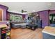 Inviting living room featuring hardwood floors, grey sofa, fan and an open layout at 801 Hanover St, Aurora, CO 80010