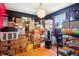 Room filled with moving boxes illuminated by a stylish pendant light and natural light from a window at 801 Hanover St, Aurora, CO 80010