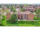 Aerial view showcases the apartment complex and its surrounding green spaces at 201 Wright St # 105, Lakewood, CO 80228