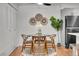 Charming dining area with modern table set, stylish decor, and an open layout to the kitchen at 201 Wright St # 105, Lakewood, CO 80228