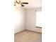 Neutral bedroom with carpet, window, and ceiling fan at 10515 W Dartmouth Ave, Lakewood, CO 80227