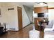 Bright living area with hardwood floors and an open layout, adjacent to the kitchen at 10515 W Dartmouth Ave, Lakewood, CO 80227