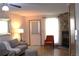 Comfortable living room with a stone fireplace, and neutral decor at 10515 W Dartmouth Ave, Lakewood, CO 80227