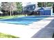 Outdoor community pool with a blue cover over the water and a blue building in the background at 10515 W Dartmouth Ave, Lakewood, CO 80227