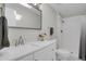 This bathroom features a modern vanity, a large mirror, and a shower at 2301 Dunbar Ct, Longmont, CO 80501
