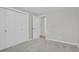This bedroom features soft grey carpet, light grey paint, and closet at 2301 Dunbar Ct, Longmont, CO 80501