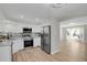 Modern kitchen featuring stainless steel appliances and white cabinets at 2301 Dunbar Ct, Longmont, CO 80501