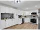 Well-lit kitchen boasts granite countertops and stainless steel appliances at 2301 Dunbar Ct, Longmont, CO 80501