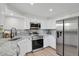 The kitchen has stainless steel appliances and granite countertops at 2301 Dunbar Ct, Longmont, CO 80501