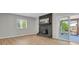 Living room features a brick fireplace and sliding glass doors at 2301 Dunbar Ct, Longmont, CO 80501