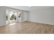Bright living room features hardwood floors, large windows and neutral paint at 2301 Dunbar Ct, Longmont, CO 80501