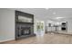 Open floor plan living room with fireplace and kitchen access at 2301 Dunbar Ct, Longmont, CO 80501