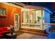 Cozy back deck with comfortable seating, plants, and a view of the beautiful backyard at 1521 Pontiac St, Denver, CO 80220