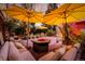 Spacious backyard patio with lounge seating and fire pit, perfect for outdoor gatherings at 1521 Pontiac St, Denver, CO 80220