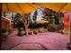 Inviting backyard patio with stone pavers, seating areas, and manicured landscaping at 1521 Pontiac St, Denver, CO 80220