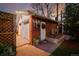 Charming detached garage with brick facade, complemented by a well-maintained garden at 1521 Pontiac St, Denver, CO 80220
