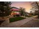 Beautiful home with well-maintained lawn and landscaping leading to an inviting entryway at 1521 Pontiac St, Denver, CO 80220