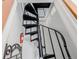 Spiral staircase leading to an upper level of the home, featuring a red fire extinguisher at 1521 Pontiac St, Denver, CO 80220