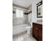 Bathroom featuring tile shower, a dark wood vanity, and modern finishes at 1312 Sandstone Ct, Boulder, CO 80305