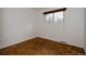 Bedroom with hardwood flooring, a window with wood trim, and pleasant natural light at 1312 Sandstone Ct, Boulder, CO 80305