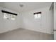 Bedroom with two bright windows, neutral carpet, and ample natural light at 1312 Sandstone Ct, Boulder, CO 80305