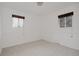 Empty bedroom with two windows, neutral walls, and carpet flooring at 1312 Sandstone Ct, Boulder, CO 80305
