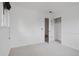 Bright bedroom featuring neutral carpet, fresh white paint, and an open closet at 1312 Sandstone Ct, Boulder, CO 80305