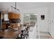 Dining area with a large wooden table, deck access, and updated cabinetry at 1312 Sandstone Ct, Boulder, CO 80305