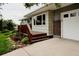Charming home with a wooden porch, a well-manicured yard, and beautiful curb appeal at 1312 Sandstone Ct, Boulder, CO 80305