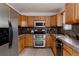 Well-equipped kitchen with stainless steel appliances, granite counters, and ample cabinet space at 1312 Sandstone Ct, Boulder, CO 80305