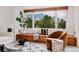 Bright living room featuring a comfortable reading nook with mountain views at 1312 Sandstone Ct, Boulder, CO 80305