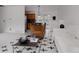 Bright living room adjacent to the kitchen with stylish accent chair at 1312 Sandstone Ct, Boulder, CO 80305