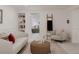 Comfortable living space with stylish decor, built-in shelving, and view to the bedroom at 1312 Sandstone Ct, Boulder, CO 80305