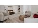 Cozy living room with neutral furniture, woven accents, and built-in shelving at 1312 Sandstone Ct, Boulder, CO 80305