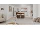 Home office space with a wooden desk, comfortable seating, and natural lighting at 1312 Sandstone Ct, Boulder, CO 80305
