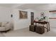 Well-lit office space featuring a wooden desk, plants, and neutral-toned seating at 1312 Sandstone Ct, Boulder, CO 80305
