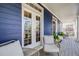 Inviting front porch with comfortable seating, showcasing the home's exterior details at 8156 E 35Th Ave, Denver, CO 80238